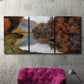 Three-panel canvas wall art featuring rowboat on quiet river bend, displayed in a living room above a suede accent chair.