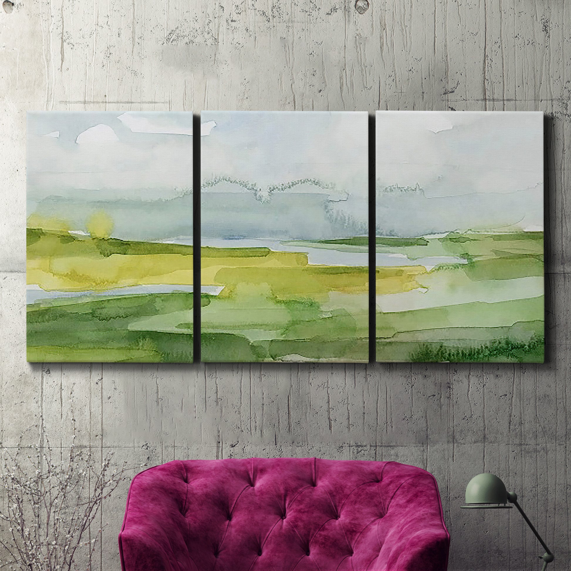 Three-panel canvas wall art featuring lowland wetlands with reflective water, displayed in a living room above a suede accent chair.