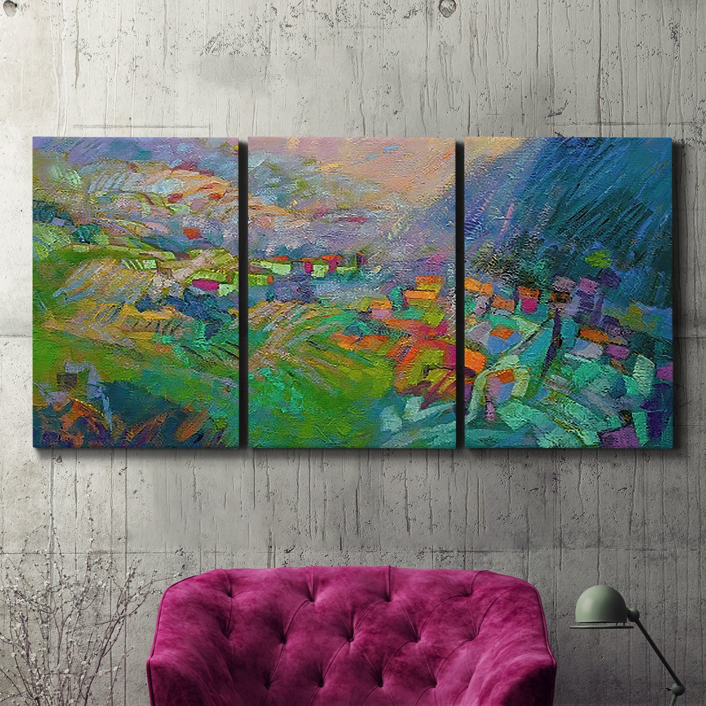 Three-panel canvas wall art featuring embracing landscape with warm tones, displayed in a living room above a suede accent chair.