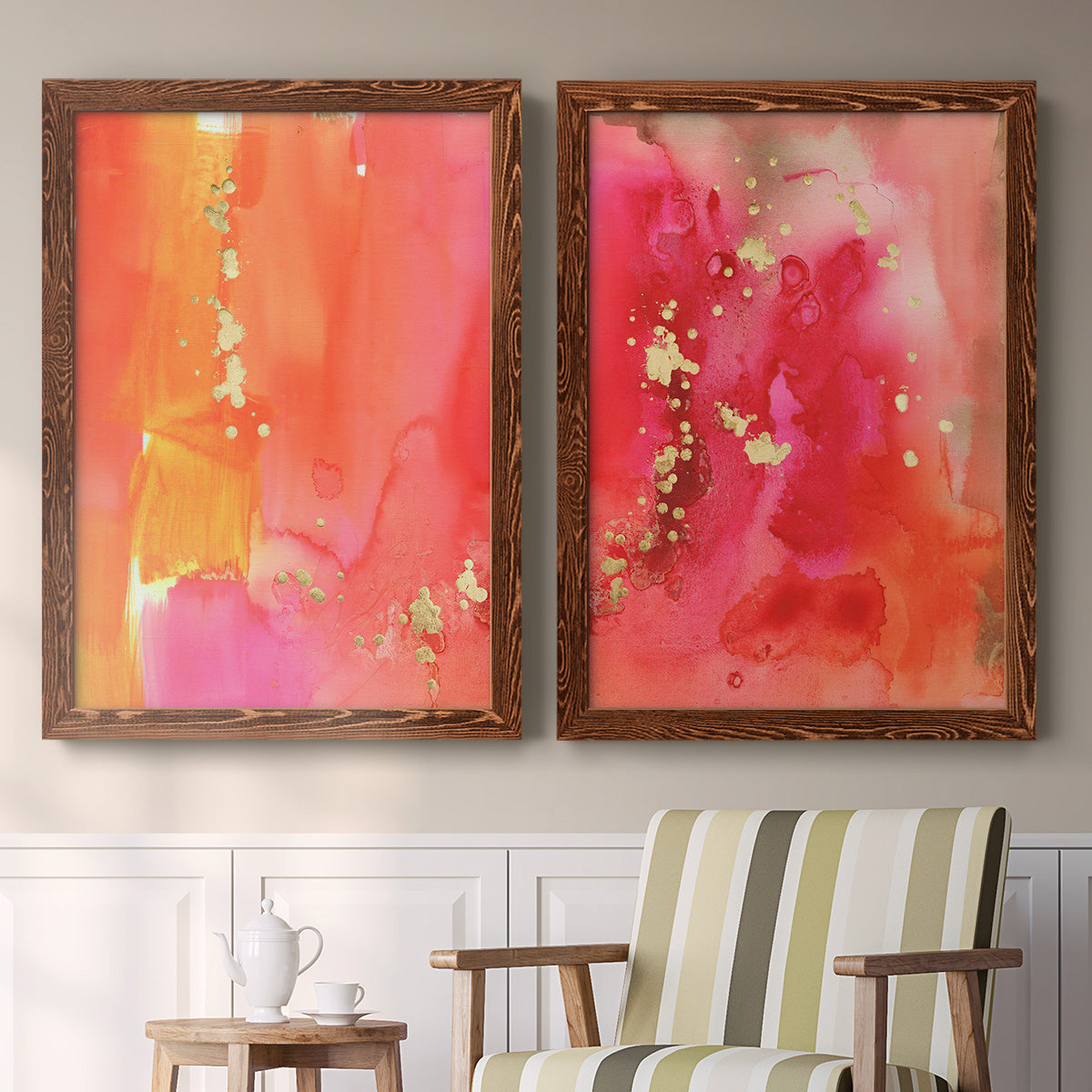Set of two maple barnwood framed canvas prints depicting two glamorous fluid abstracts featuring luminous coral orange and pink color fields with gold flecks above a sideboard in a cozy sitting room.