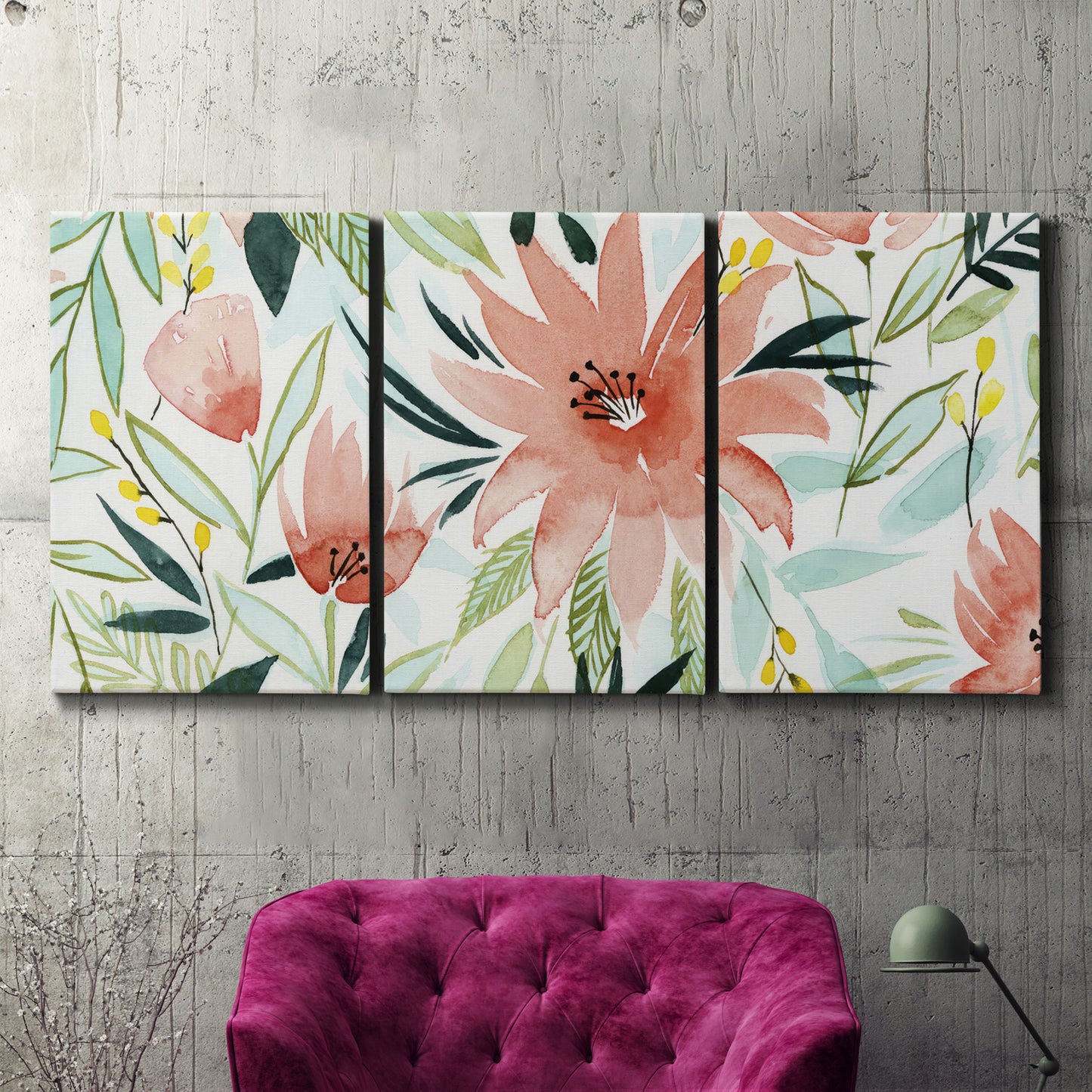Three-panel canvas wall art featuring tropical botanical collage, displayed in a living room above a suede accent chair.
