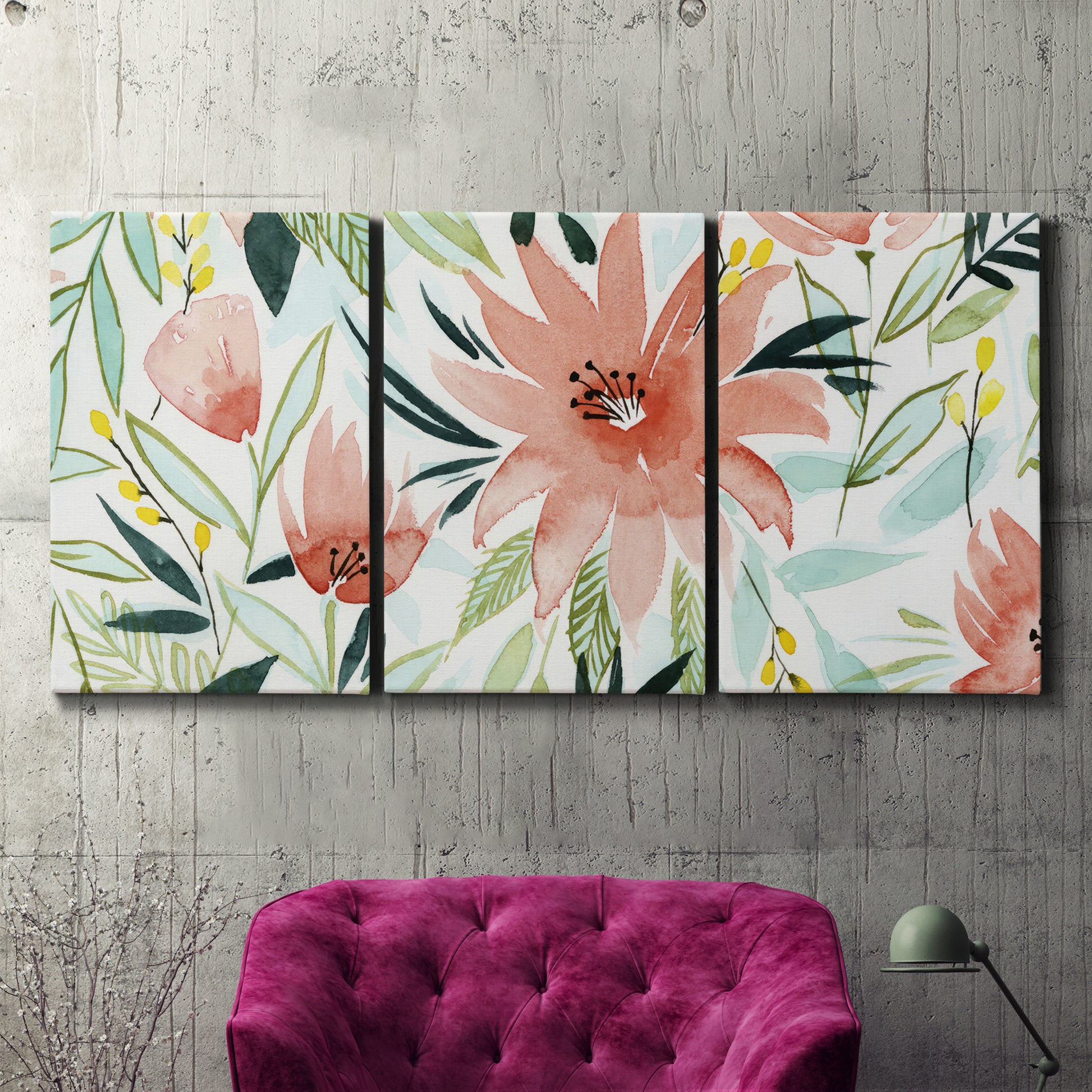 Three-panel canvas wall art featuring tropical botanical collage, displayed in a living room above a suede accent chair.