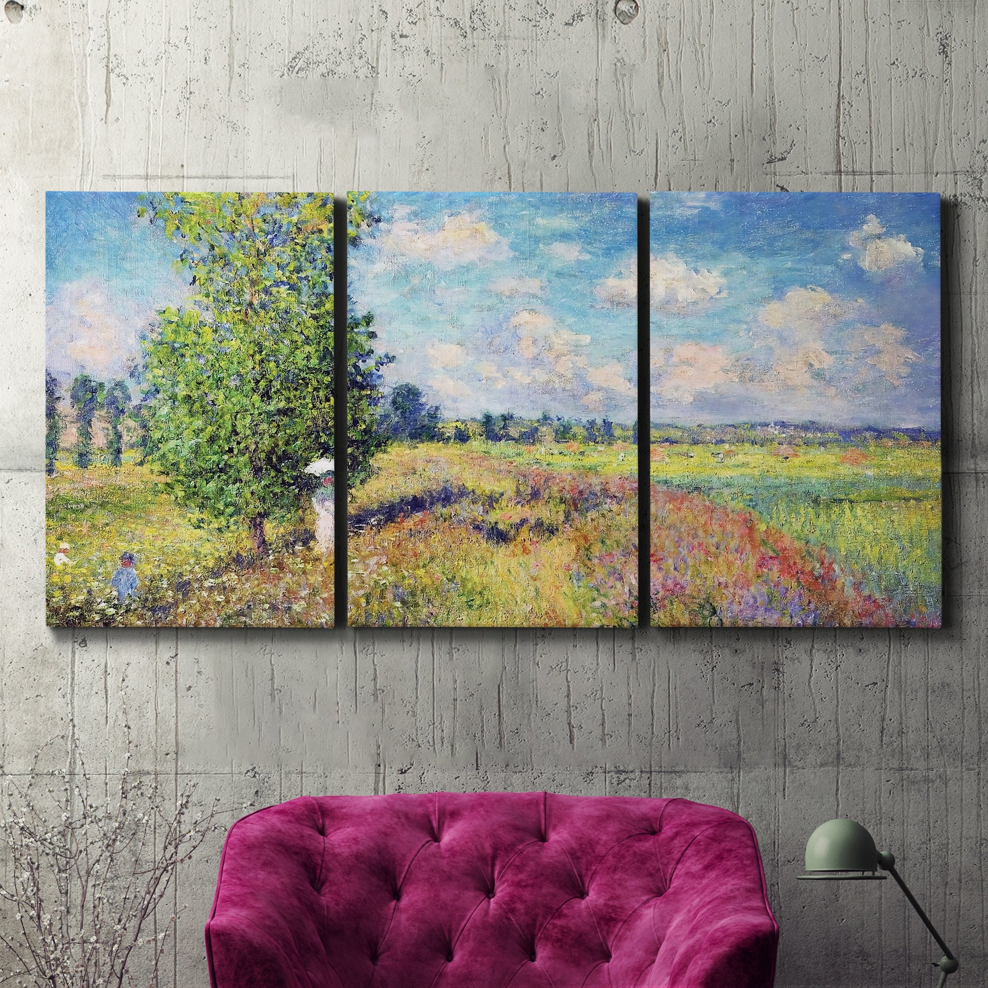 Three-panel canvas wall art featuring sunlit meadow landscape, displayed in a living room above a suede accent chair.