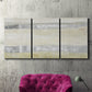 Three-panel canvas wall art featuring minimal abstract storm movement, displayed in a living room above a suede accent chair.