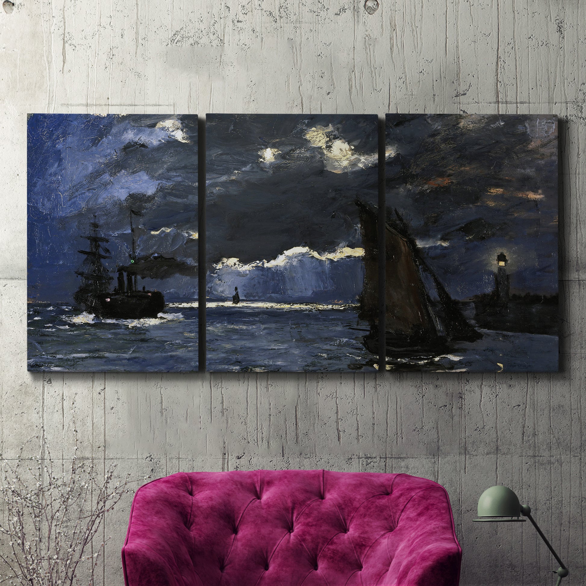 Three-panel canvas wall art featuring dark seascape under night sky, displayed in a living room above a suede accent chair.