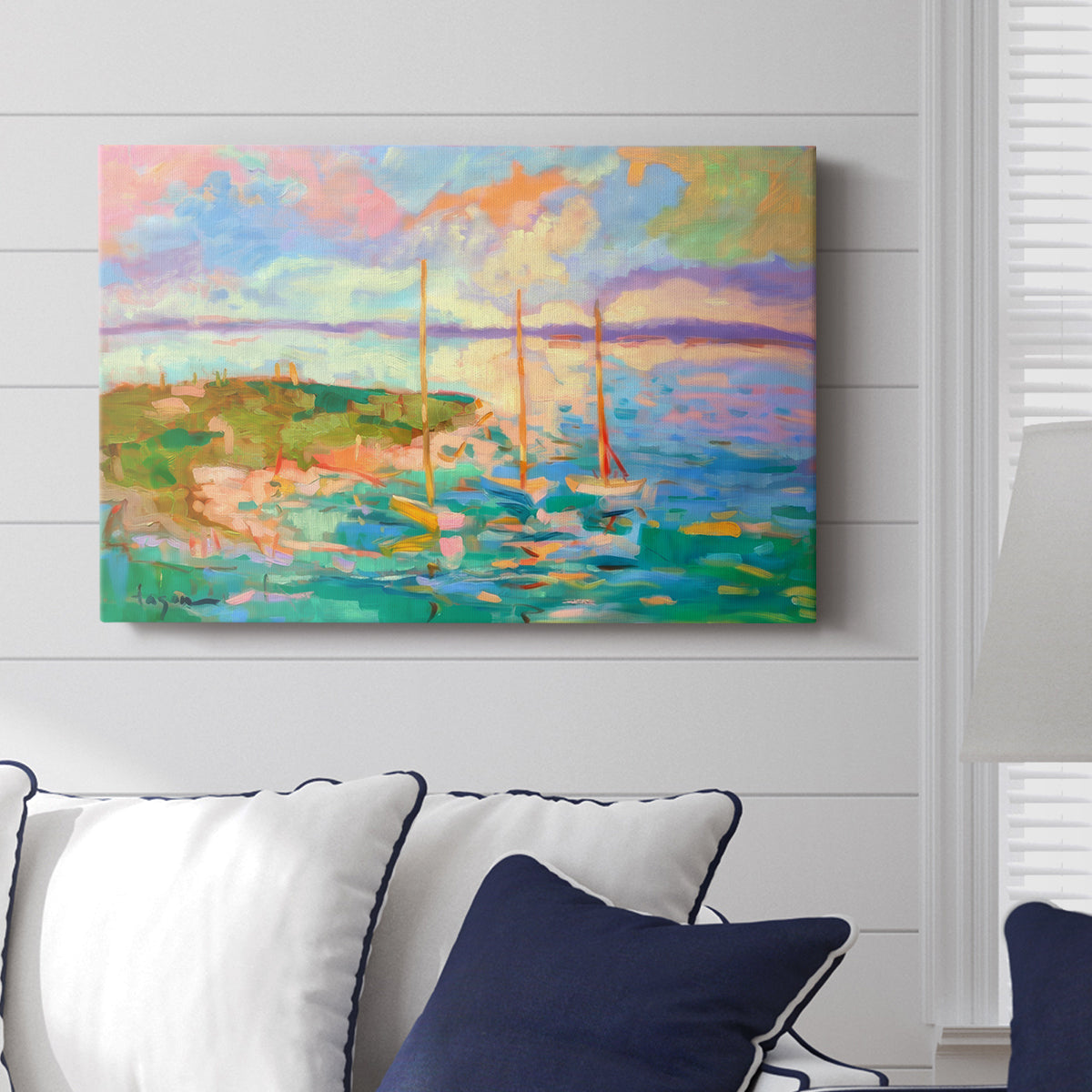 Colorful seascape with boats and vibrant skies over a coastal landscape in late afternoon light