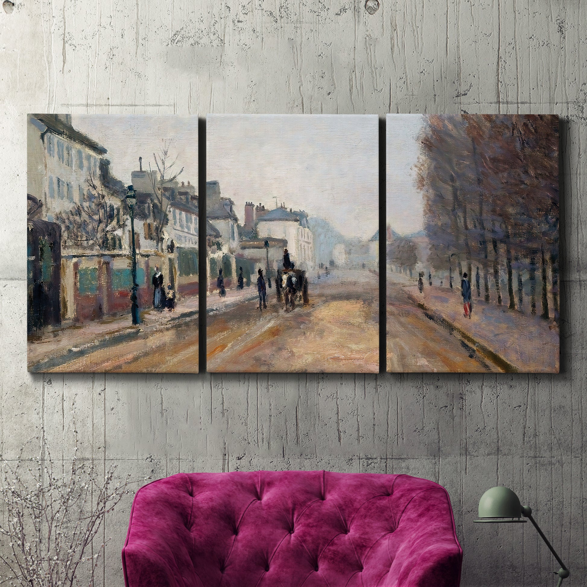 Three-panel canvas wall art featuring tree lined boulevard in town, displayed in a living room above a suede accent chair.