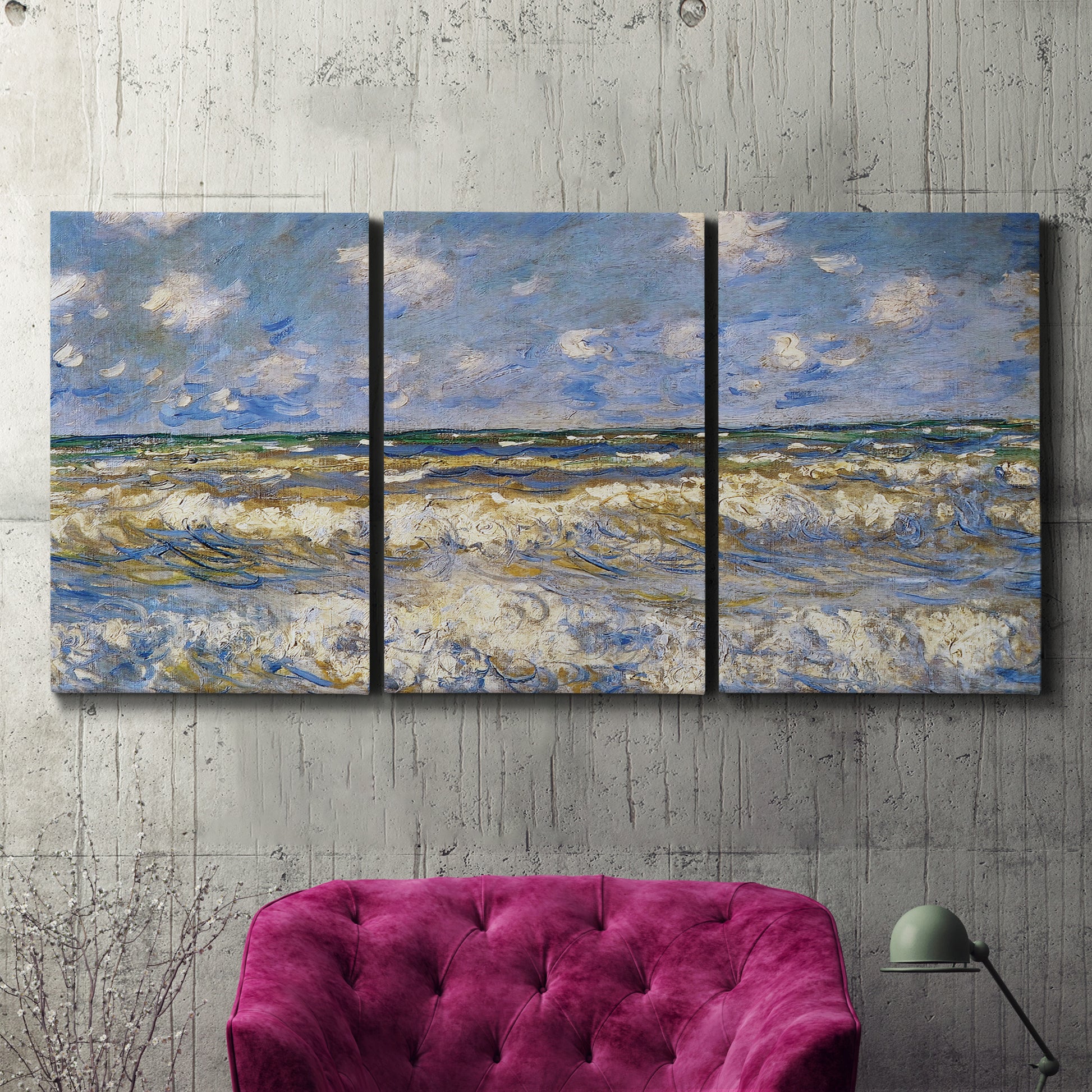 Three-panel canvas wall art featuring rough sea with crashing waves, displayed in a living room above a suede accent chair.
