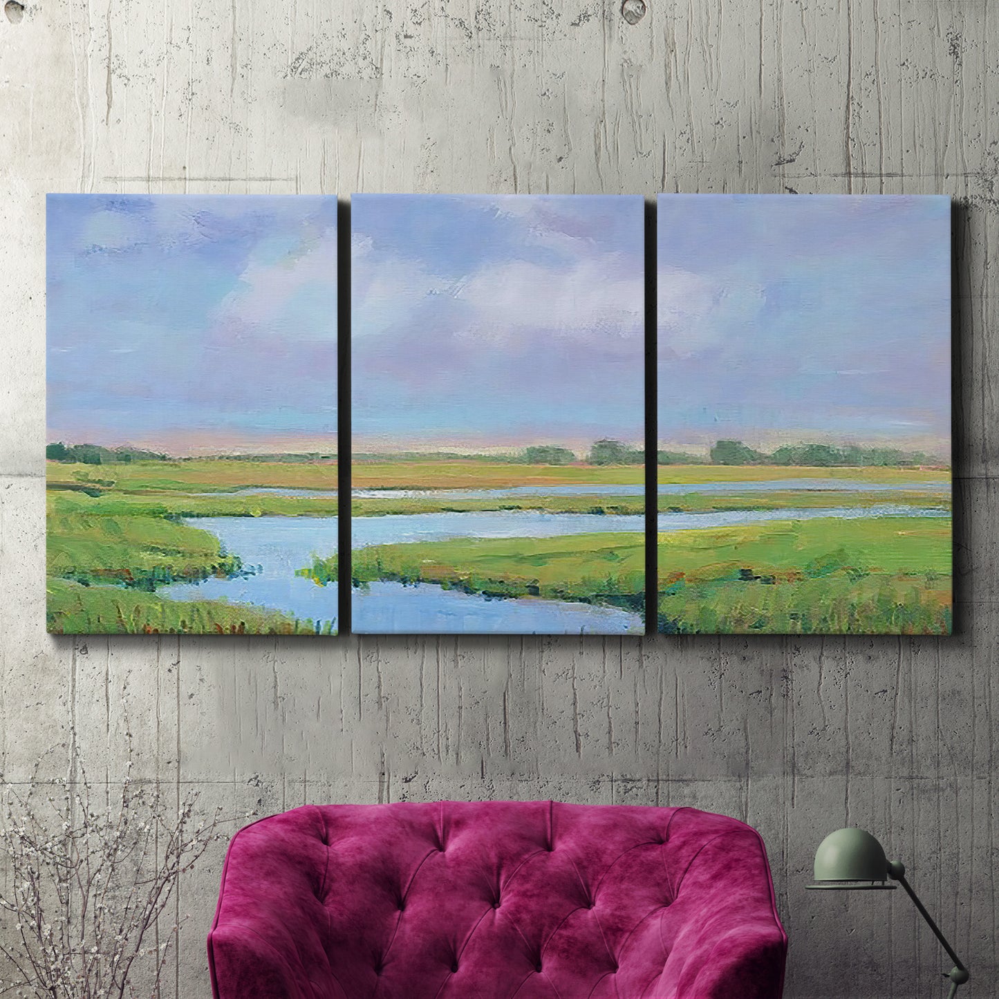 Three-panel canvas wall art featuring summer marshland with tall grasses, displayed in a living room above a suede accent chair.