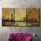 Three-panel canvas wall art featuring quiet river branch landscape, displayed in a living room above a suede accent chair.