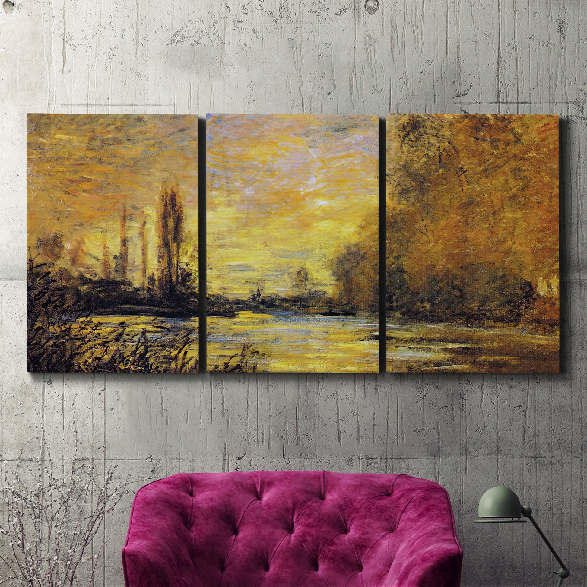 Three-panel canvas wall art featuring quiet river branch landscape, displayed in a living room above a suede accent chair.