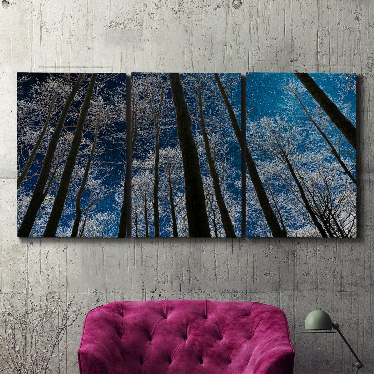 Three-panel canvas wall art featuring night landscape silhouette photography, displayed in a living room above a suede accent chair.