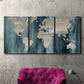 Three-panel canvas wall art featuring golden coastal sunset with cliffs, displayed in a living room above a suede accent chair.