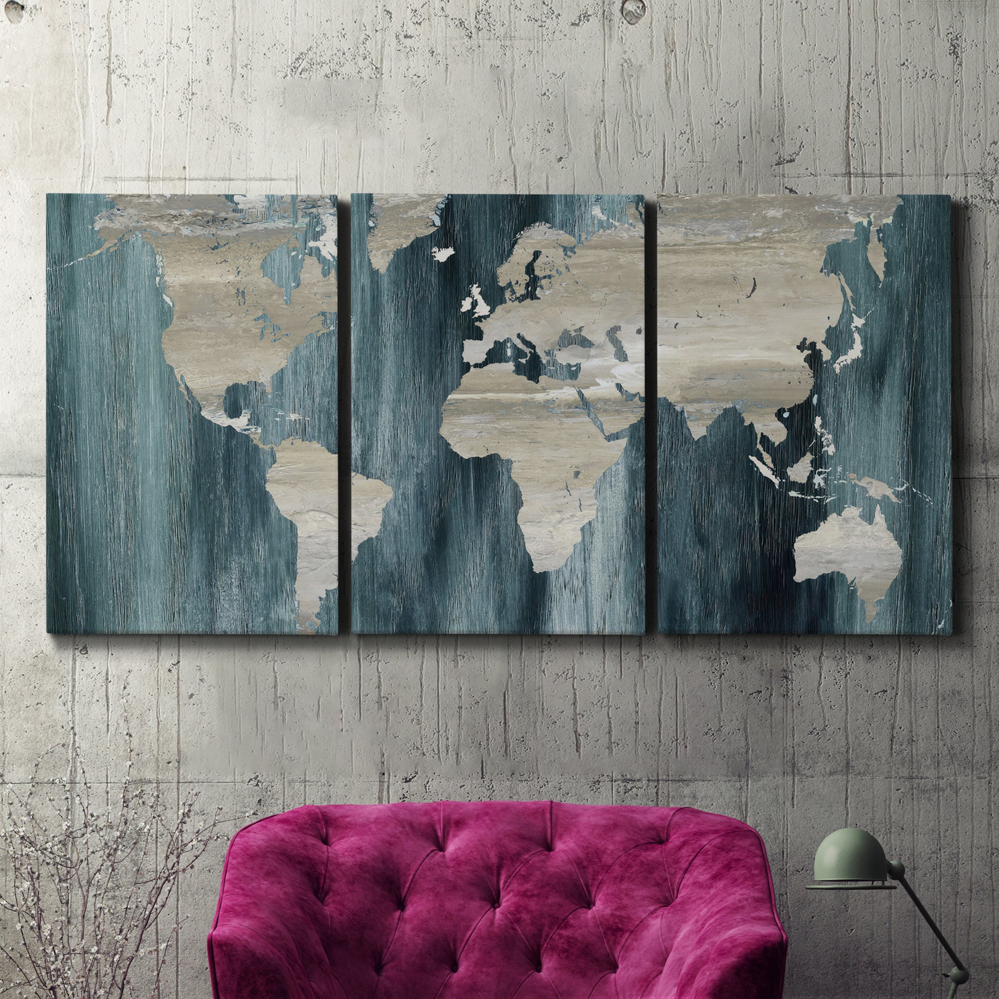 Three-panel canvas wall art featuring golden coastal sunset with cliffs, displayed in a living room above a suede accent chair.