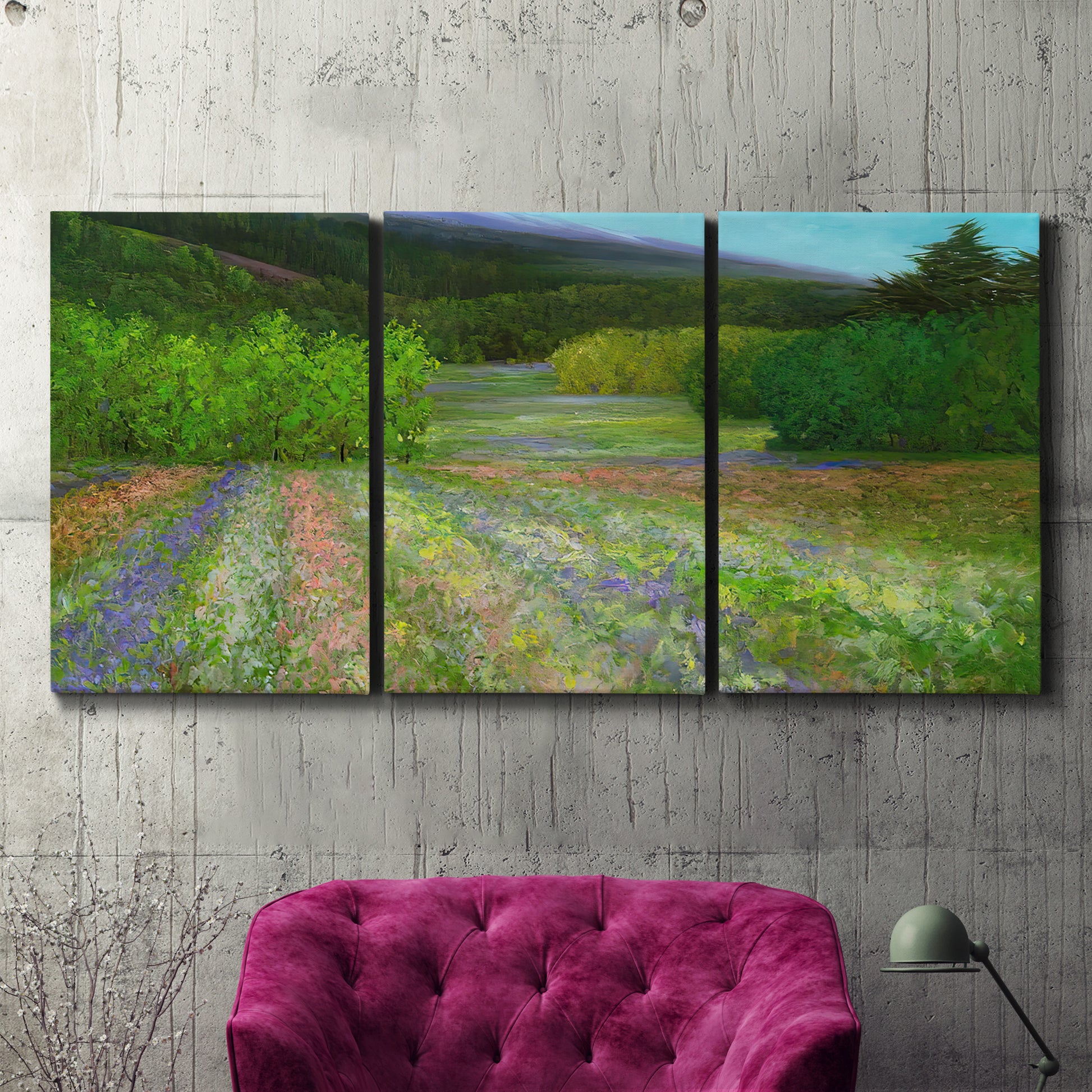 Three-panel canvas wall art featuring fresh spring meadow landscape, displayed in a living room above a suede accent chair.