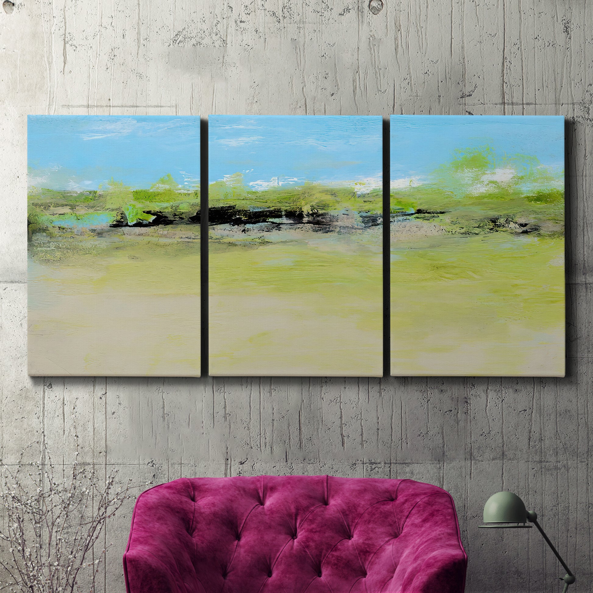 Three-panel canvas wall art featuring abstract terrace landscape view, displayed in a living room above a suede accent chair.