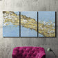 Three-panel canvas wall art featuring , displayed in a living room above a suede accent chair.