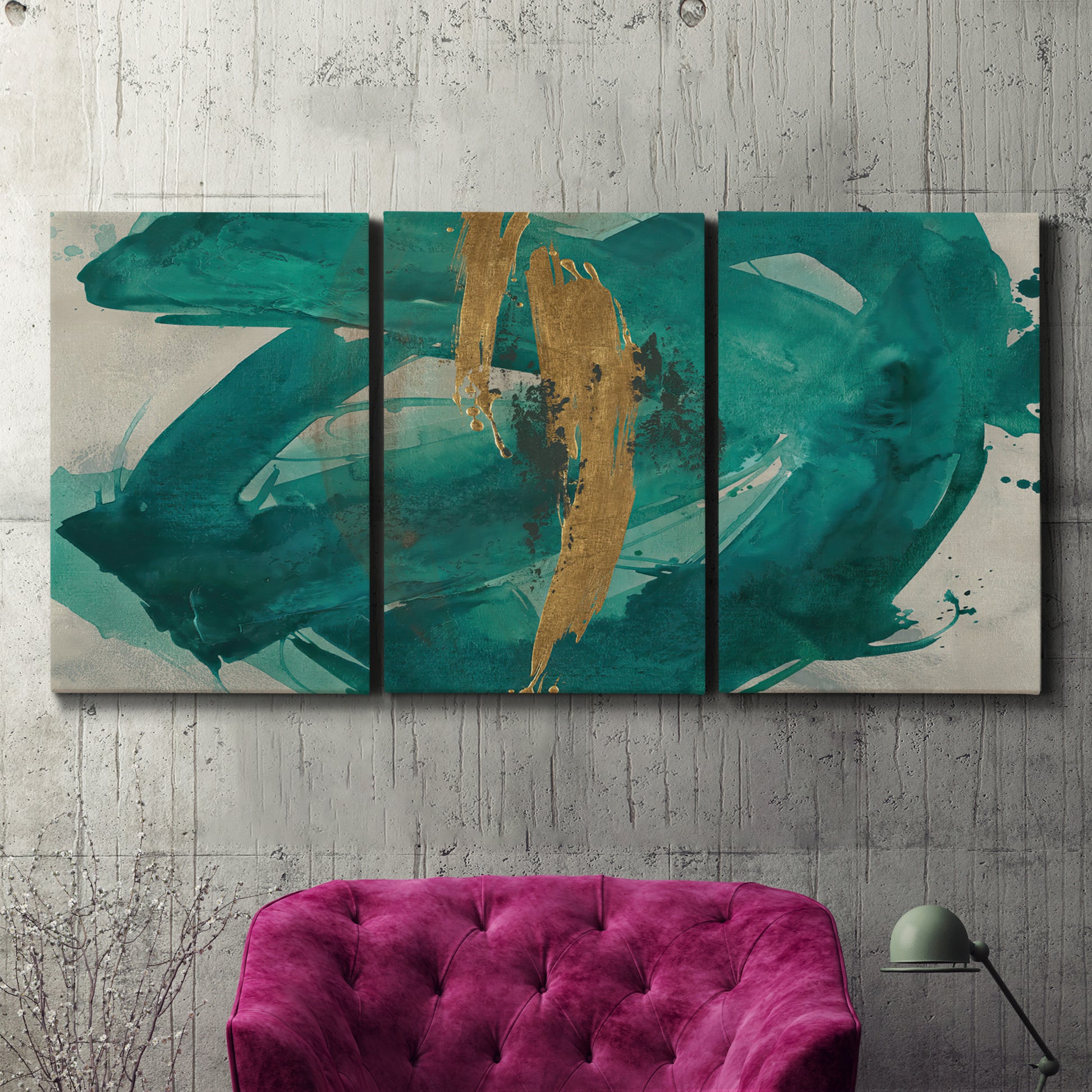 Three-panel canvas wall art featuring interconnected abstract flowing forms, displayed in a living room above a suede accent chair.