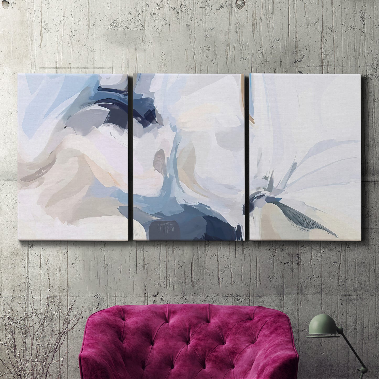 Three-panel canvas wall art featuring airy abstract movement composition, displayed in a living room above a suede accent chair.