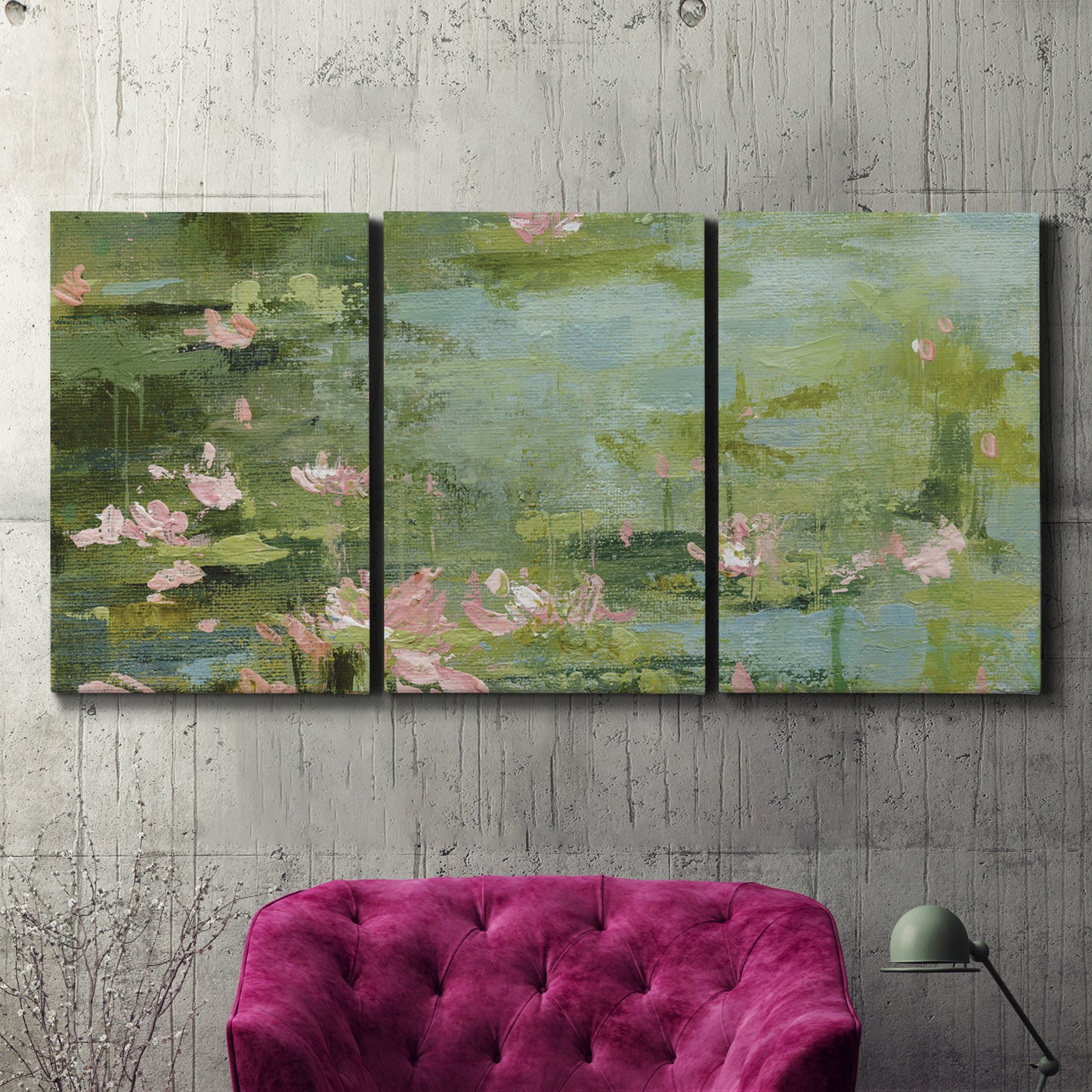 Three-panel canvas wall art featuring muted water lily pond, displayed in a living room above a suede accent chair.