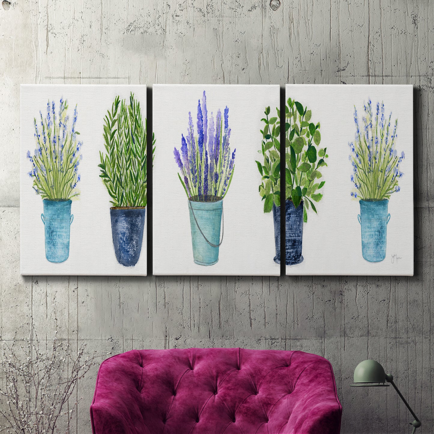 Three-panel canvas wall art featuring minimal monochrome abstract forms, displayed in a living room above a suede accent chair.