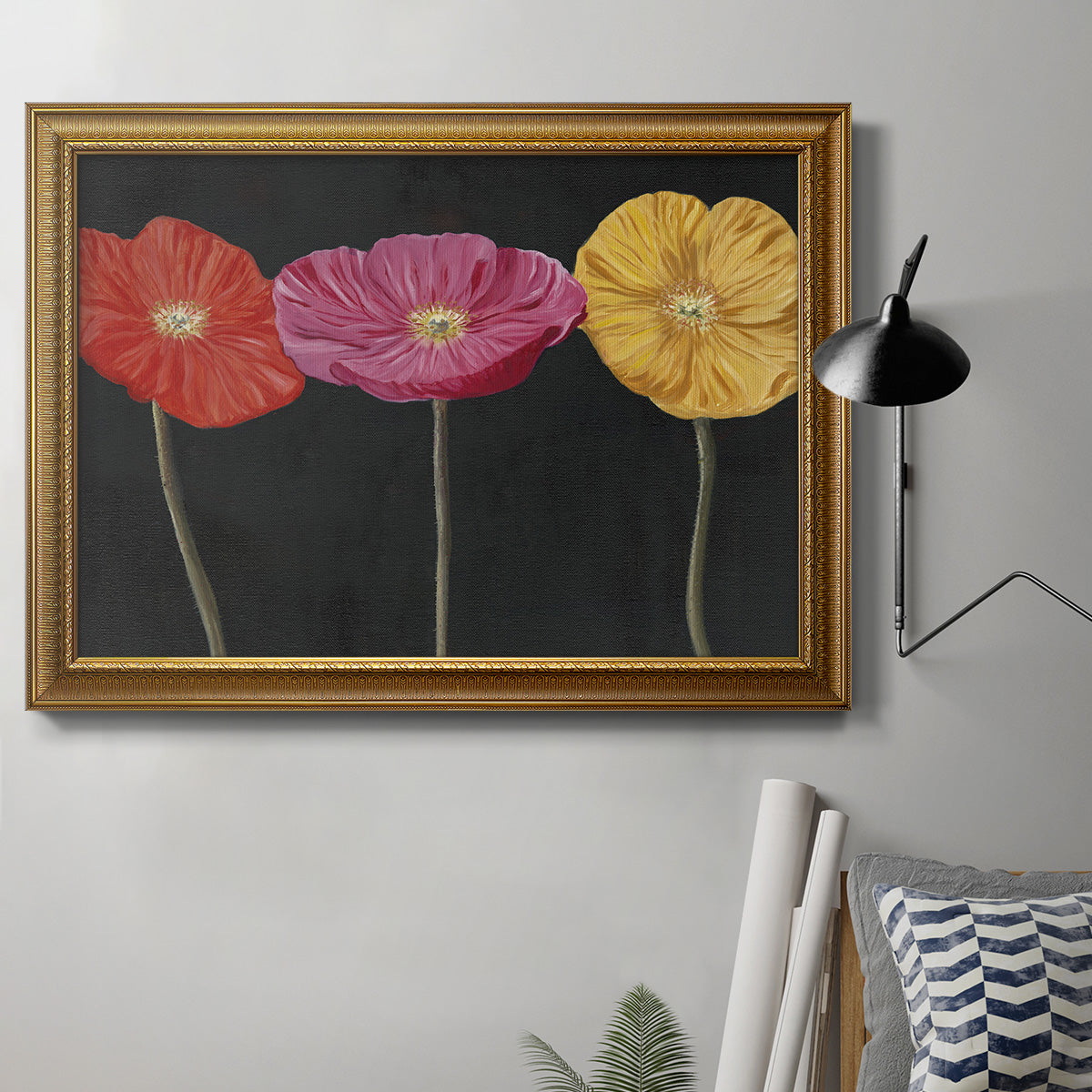 Contemporary poppy flower artwork in an ornate traditional gold frame displayed in a neutral interior setting.