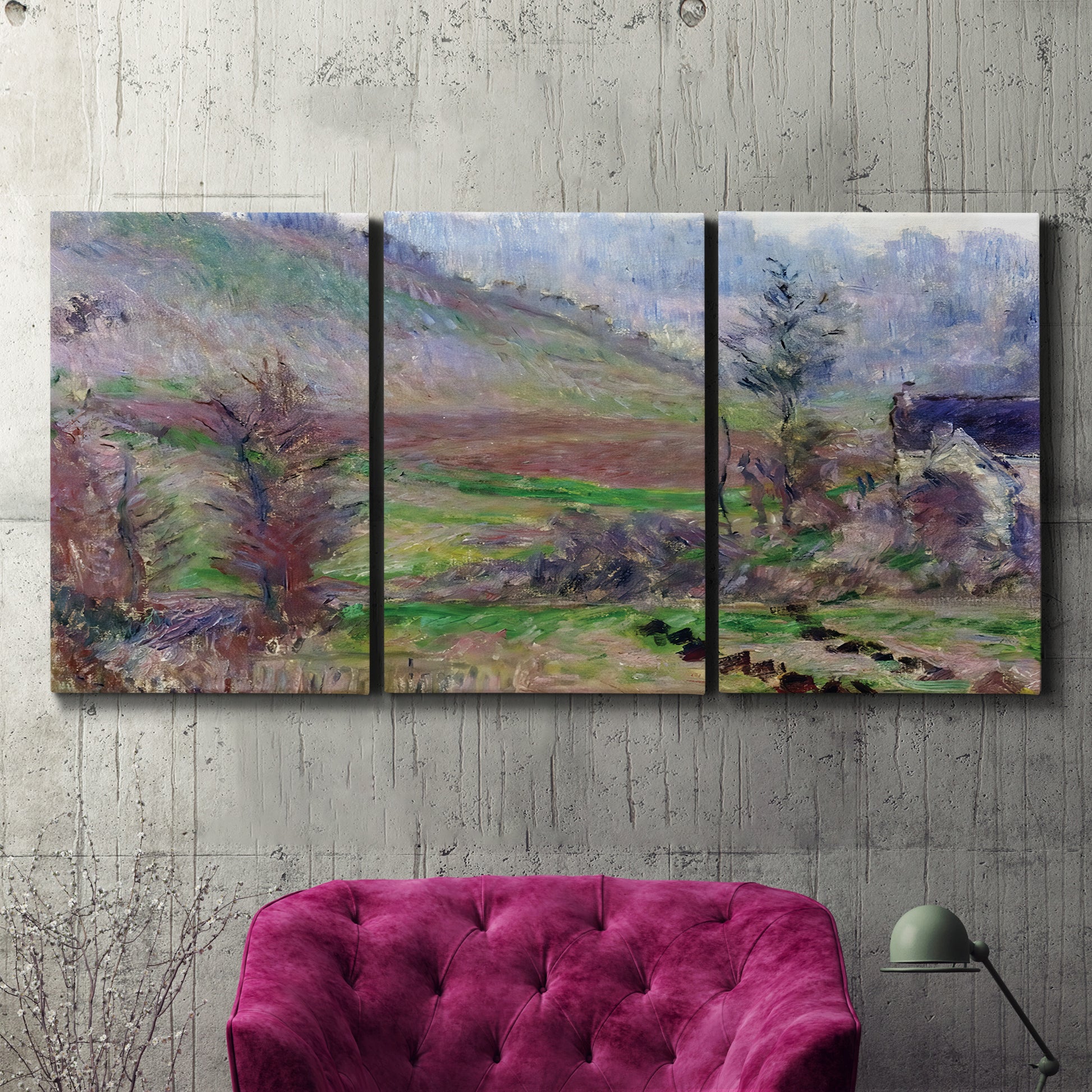 Three-panel canvas wall art featuring cliffside cottage overlooking sea, displayed in a living room above a suede accent chair.