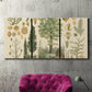 Three-panel canvas wall art featuring vintage floral botanical collage, displayed in a living room above a suede accent chair.