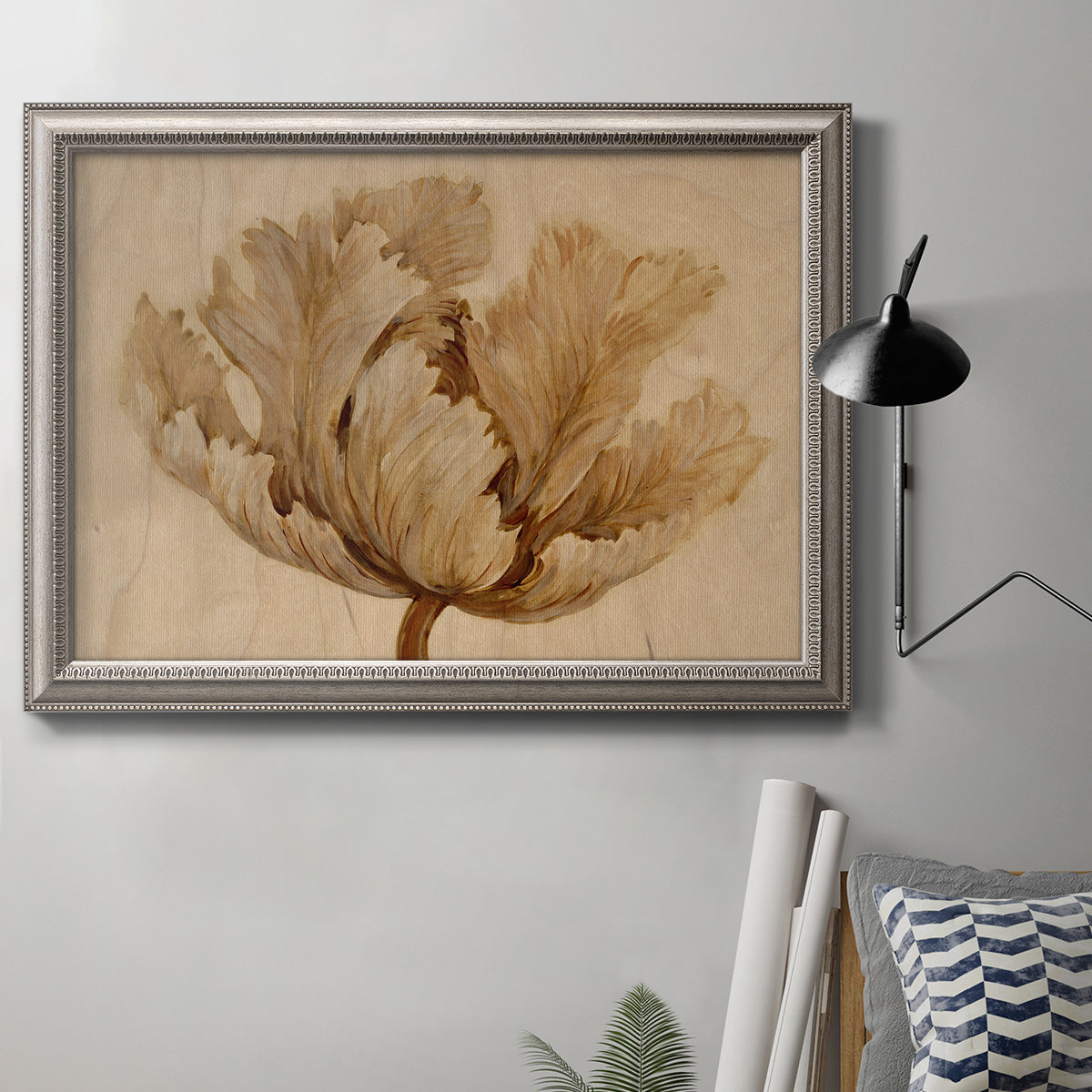 Minimalist sepia tulip botanical artwork in an ornate vintage silver frame displayed in a neutral interior setting.