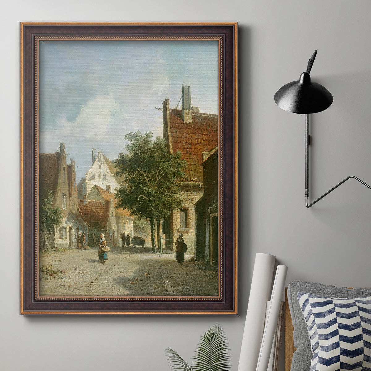 Rustic European street scene painting by Adriaan Eversen in an ornate bronzed mahogany wood frame displayed in a neutral interior setting.