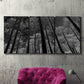 Three-panel canvas wall art featuring riverside houses along canal, displayed in a living room above a suede accent chair.