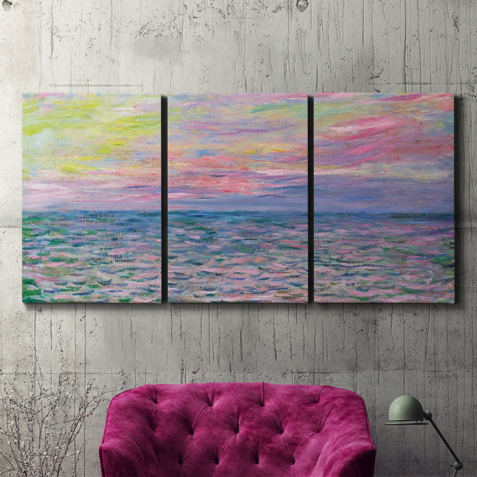 Three-panel canvas wall art featuring sunset reflections across calm sea, displayed in a living room above a suede accent chair.
