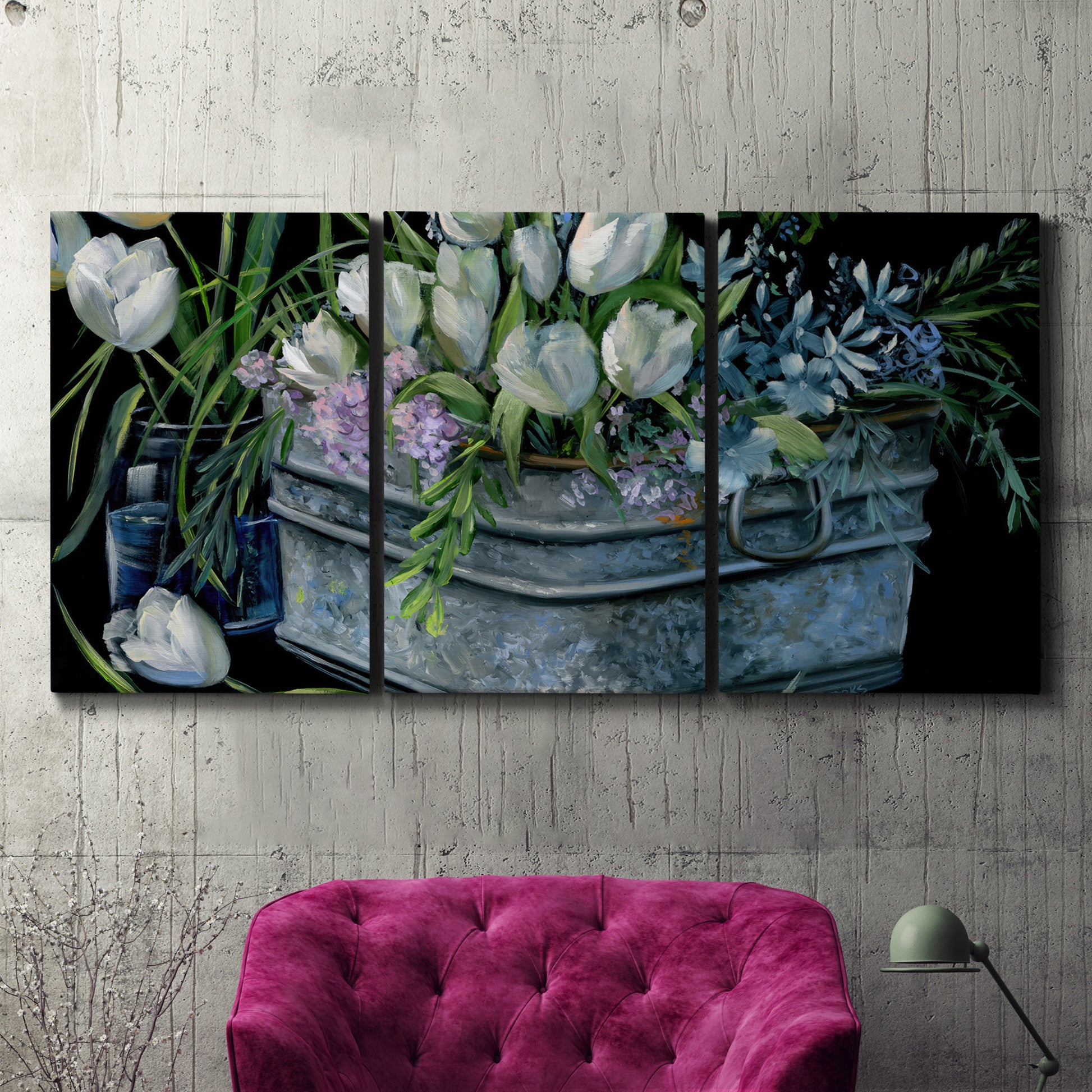 Three-panel canvas wall art featuring colorful wild tulips in bloom, displayed in a living room above a suede accent chair.