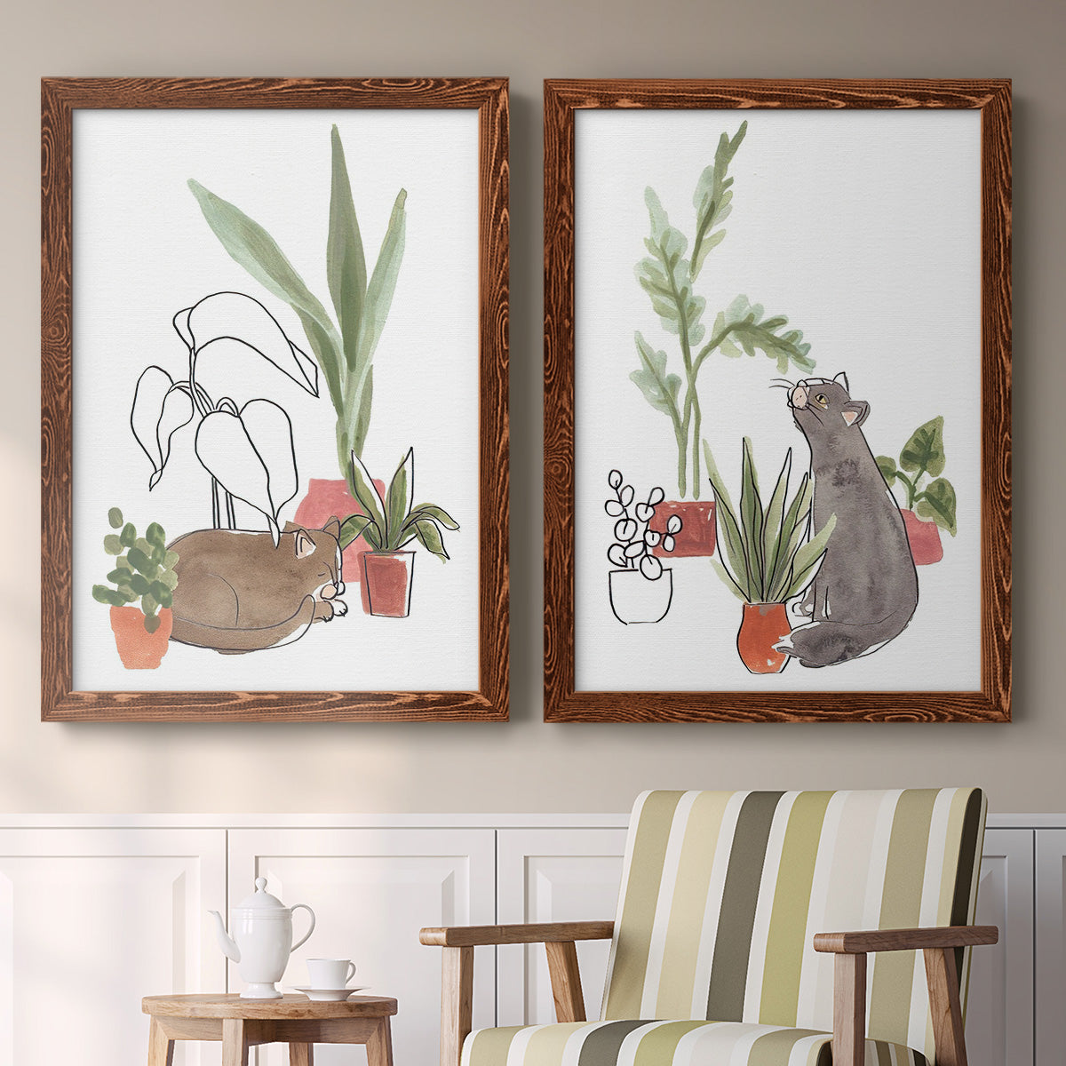 Set of two maple barnwood framed canvas prints depicting two whimsical botanical animal illustrations featuring cats tucked among collections of potted houseplants above a sideboard in a cozy sitting room.