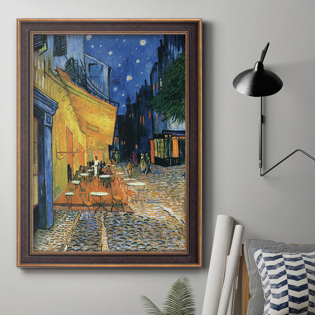 Impressionist night café street scene by Vincent van Gogh in an ornate bronzed mahogany wood frame displayed in a neutral interior setting.