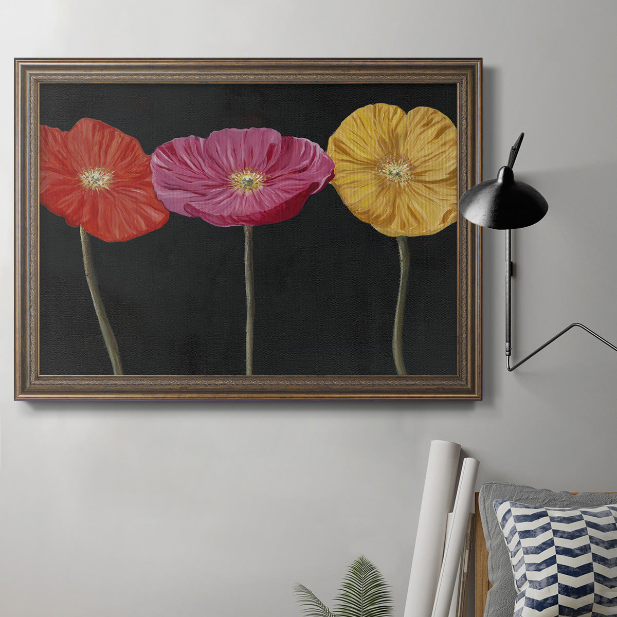 Contemporary poppy flower artwork in an ornate traditional bronze frame displayed in a neutral interior setting.