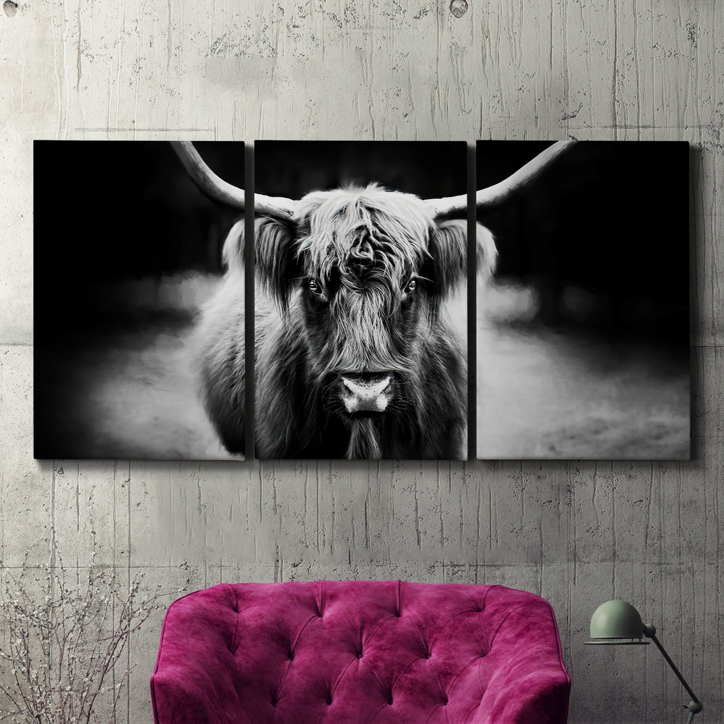 Three-panel canvas wall art featuring black and white cattle portrait, displayed in a living room above a suede accent chair.