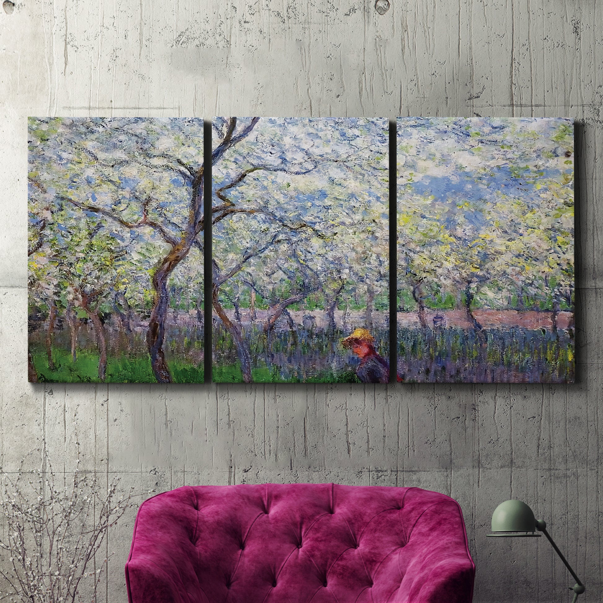 Three-panel canvas wall art featuring fresh spring countryside landscape, displayed in a living room above a suede accent chair.