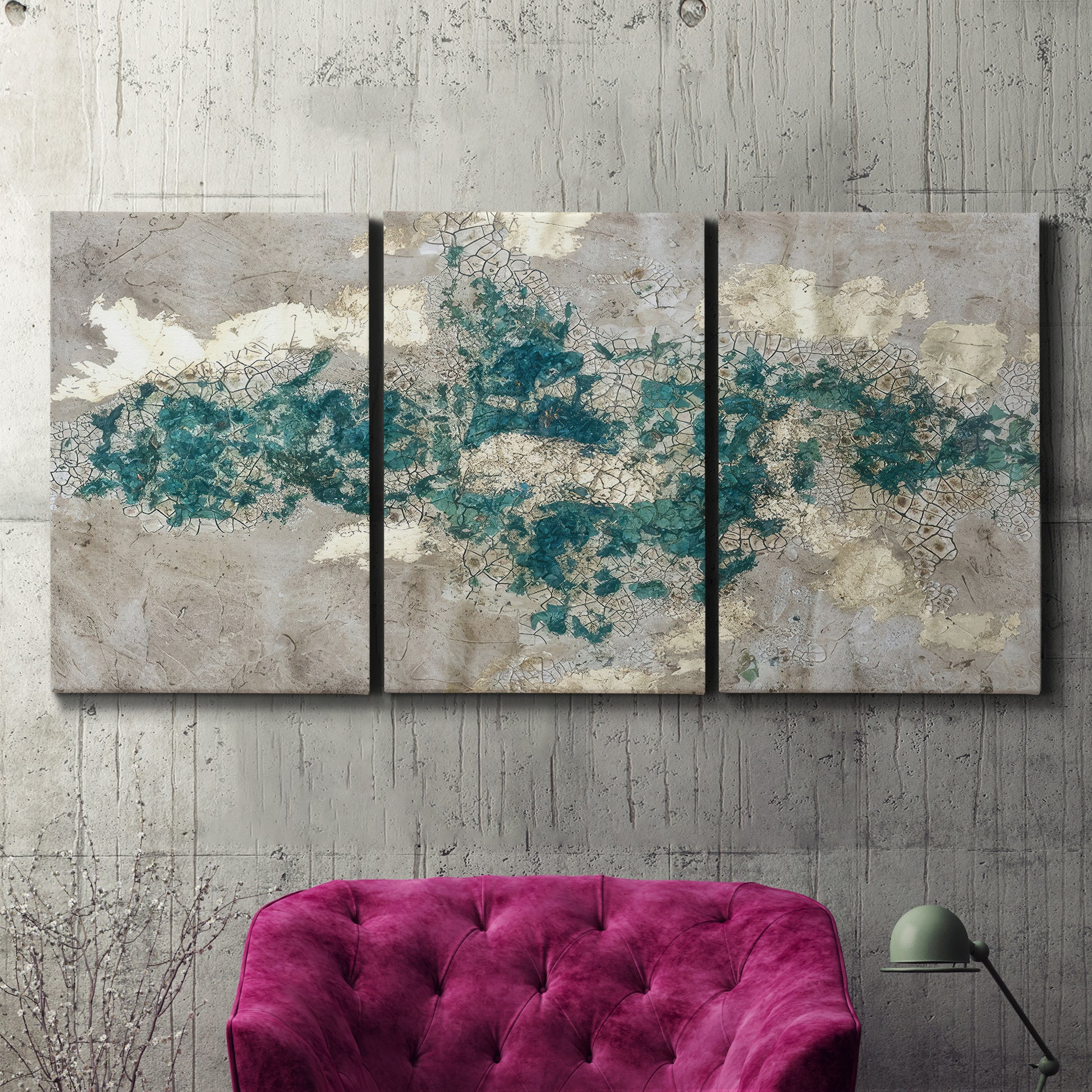 Three-panel canvas wall art featuring layered mineral abstract textures, displayed in a living room above a suede accent chair.