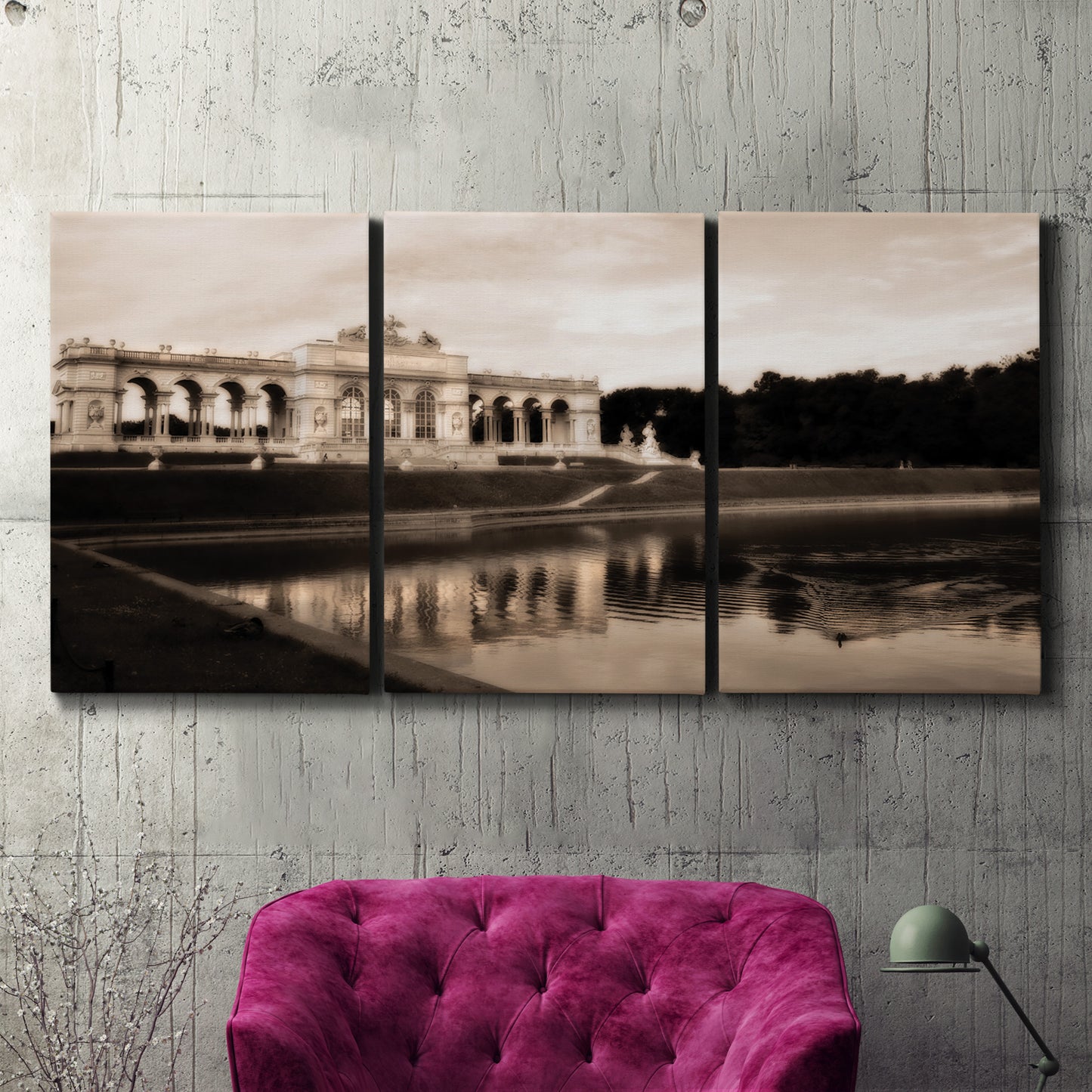 Three-panel canvas wall art featuring monochrome historic pavilion photograph, displayed in a living room above a suede accent chair.