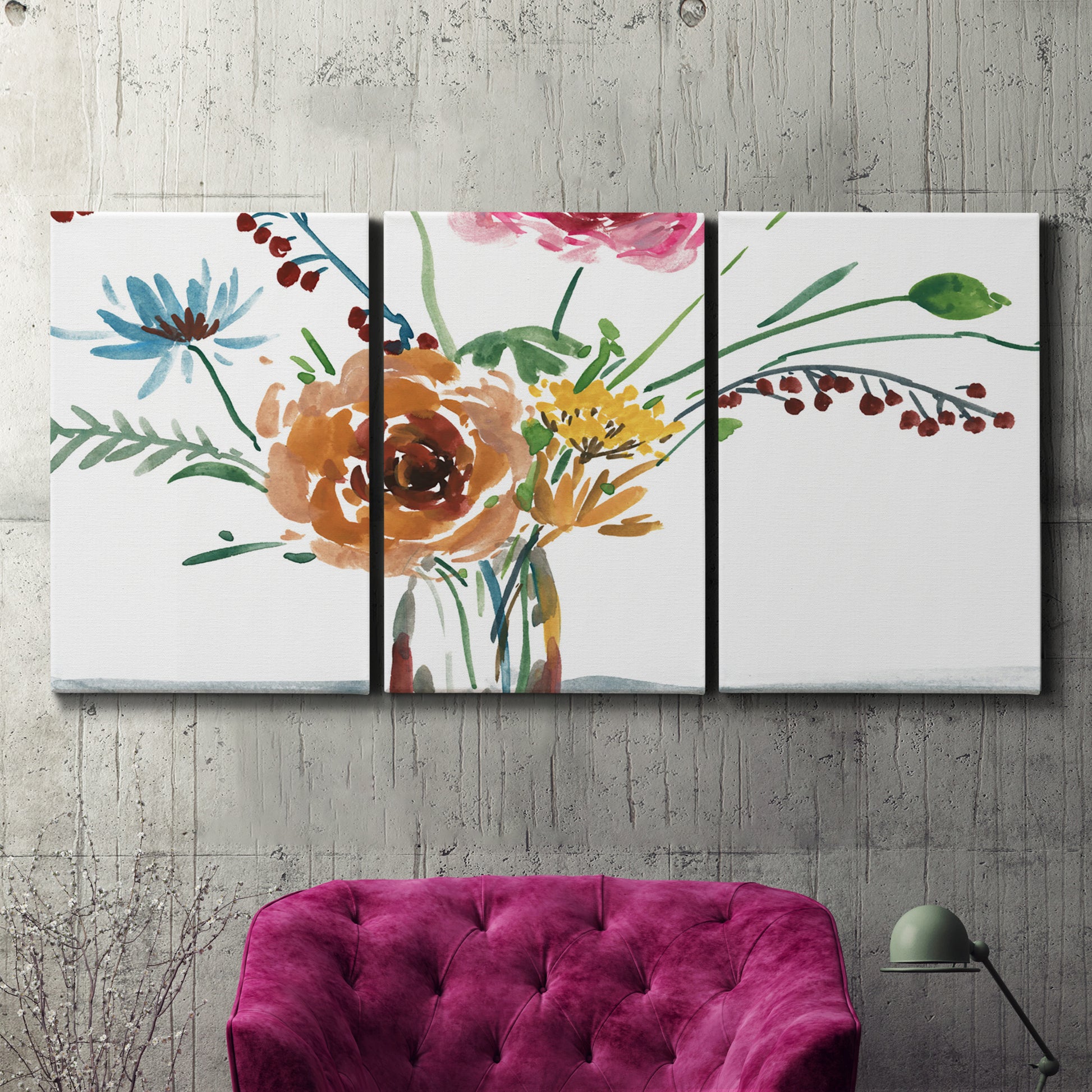 Three-panel canvas wall art featuring vibrant floral bouquet, displayed in a living room above a suede accent chair.