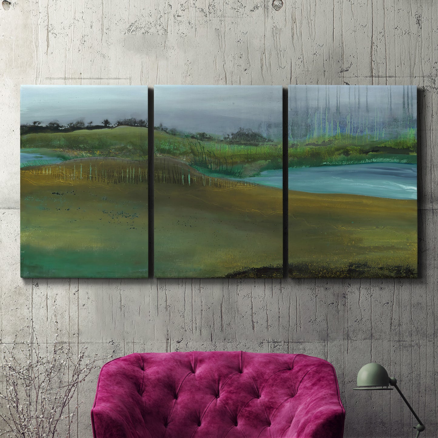 Three-panel canvas wall art featuring quiet contemplative landscape scene, displayed in a living room above a suede accent chair.