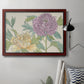 Contemporary peony flower illustration in an ornate cherry burl wood frame displayed in a neutral interior setting.