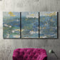 Three-panel canvas wall art featuring sparkling abstract sea surface, displayed in a living room above a suede accent chair.