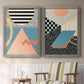 Set of two gray barnwood framed canvas prints depicting two retro graphic abstracts featuring bold geometric Memphis-style patterns above a sideboard in a cozy sitting room.