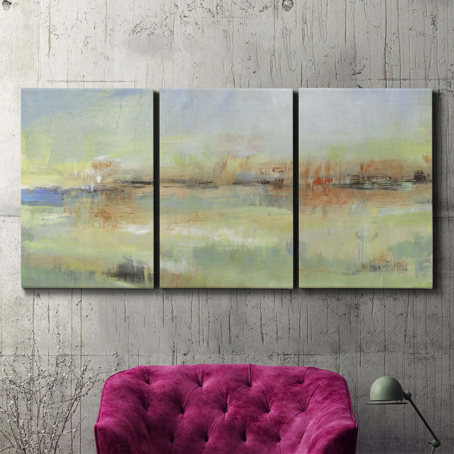 Three-panel canvas wall art featuring layered abstract transitional textures, displayed in a living room above a suede accent chair.