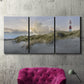 Three-panel canvas wall art featuring guardian boat along shoreline, displayed in a living room above a suede accent chair.