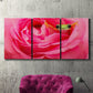 Three-panel canvas wall art featuring animal photography with floral elements, displayed in a living room above a suede accent chair.