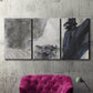 Three-panel canvas wall art featuring dark abstract atmospheric landscape, displayed in a living room above a suede accent chair.