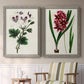 Set of two gray barnwood framed canvas prints depicting two antique botanical plate illustrations featuring colorful flowering plant specimens above a sideboard in a cozy sitting room.